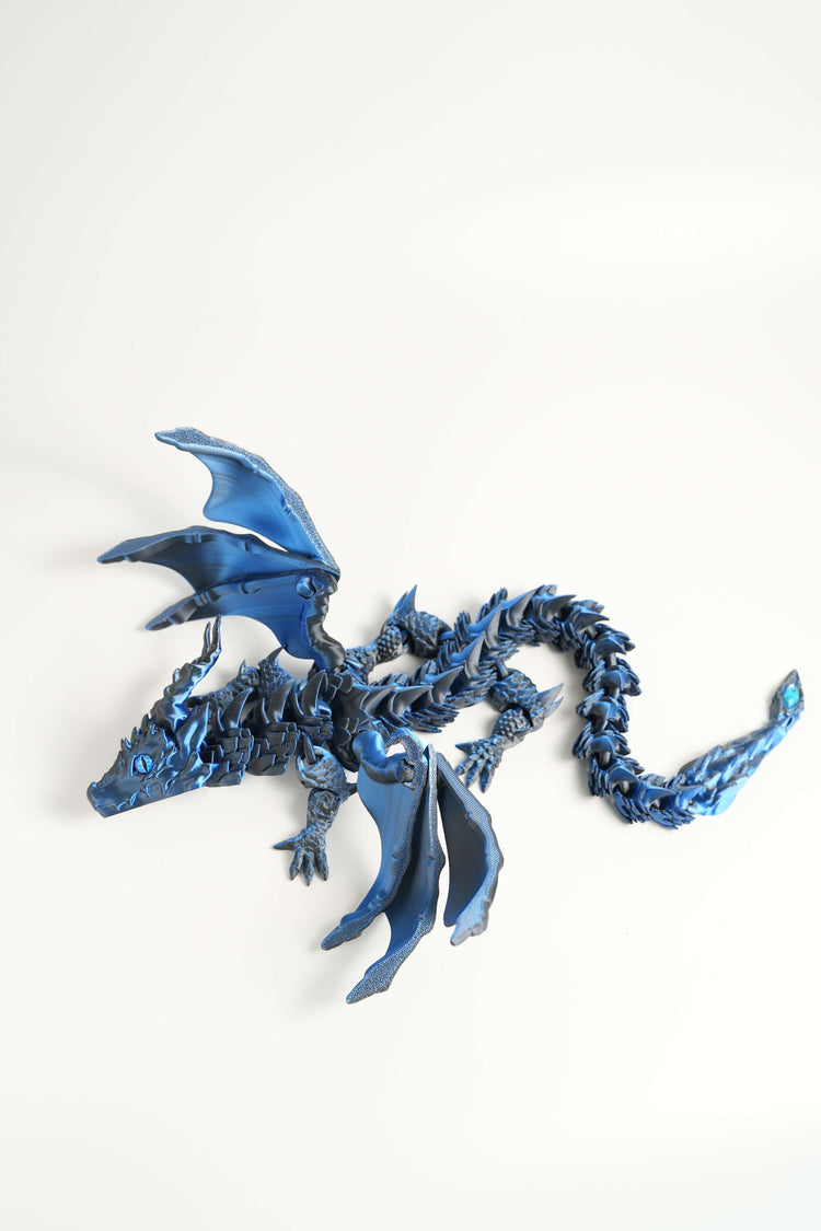 Blue dragon figurine on a white background
